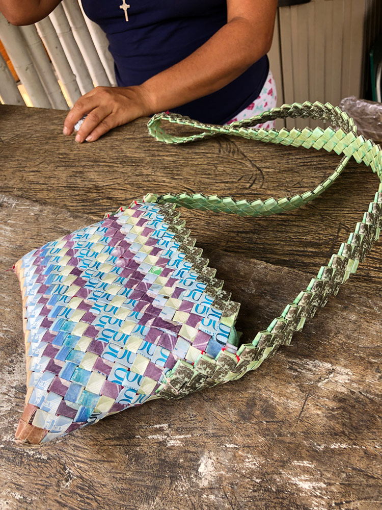 The Venezuelan currency became so worthless from hyperinflation that it is used for crafts.  A Venezuelan woman working at the refugee camp we visited made this purse out of Venezuelan Bolivars.